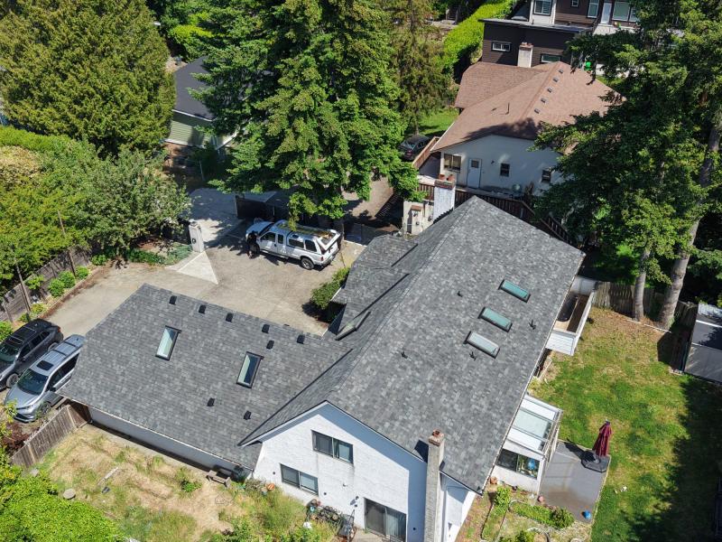 Charcoal shingle roof with skylights