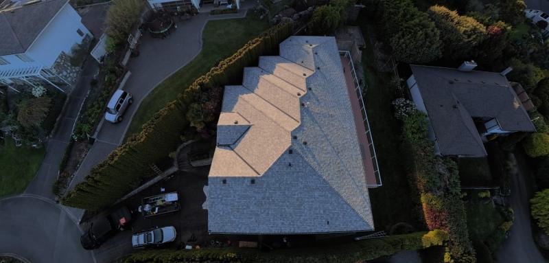 Evening aerial of a completed roof replacement